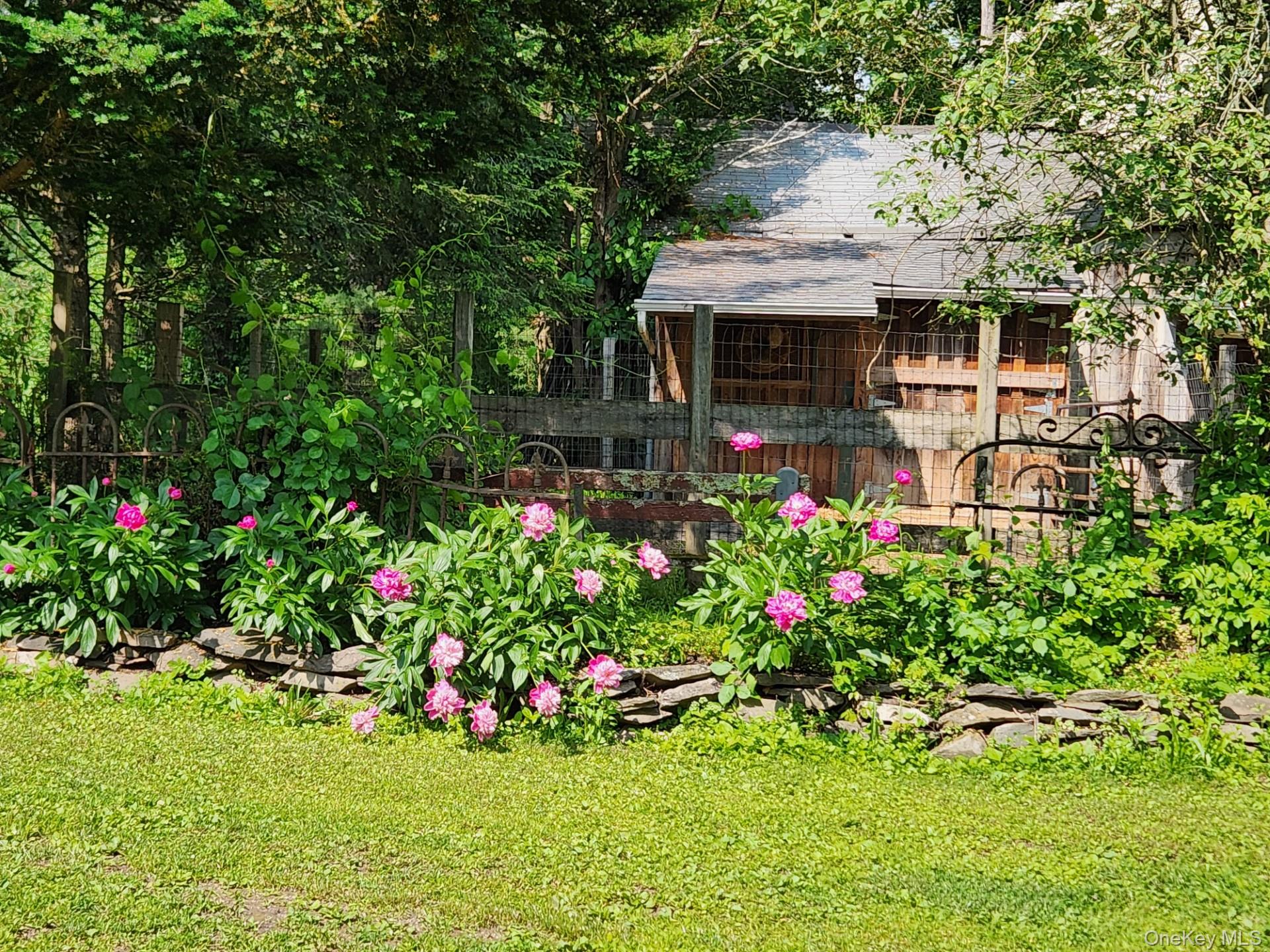 93 Widmer Road Wappingers Falls, NY 12590 - Photo 36 of 45 Many Perennials. Barn with stall, storage area