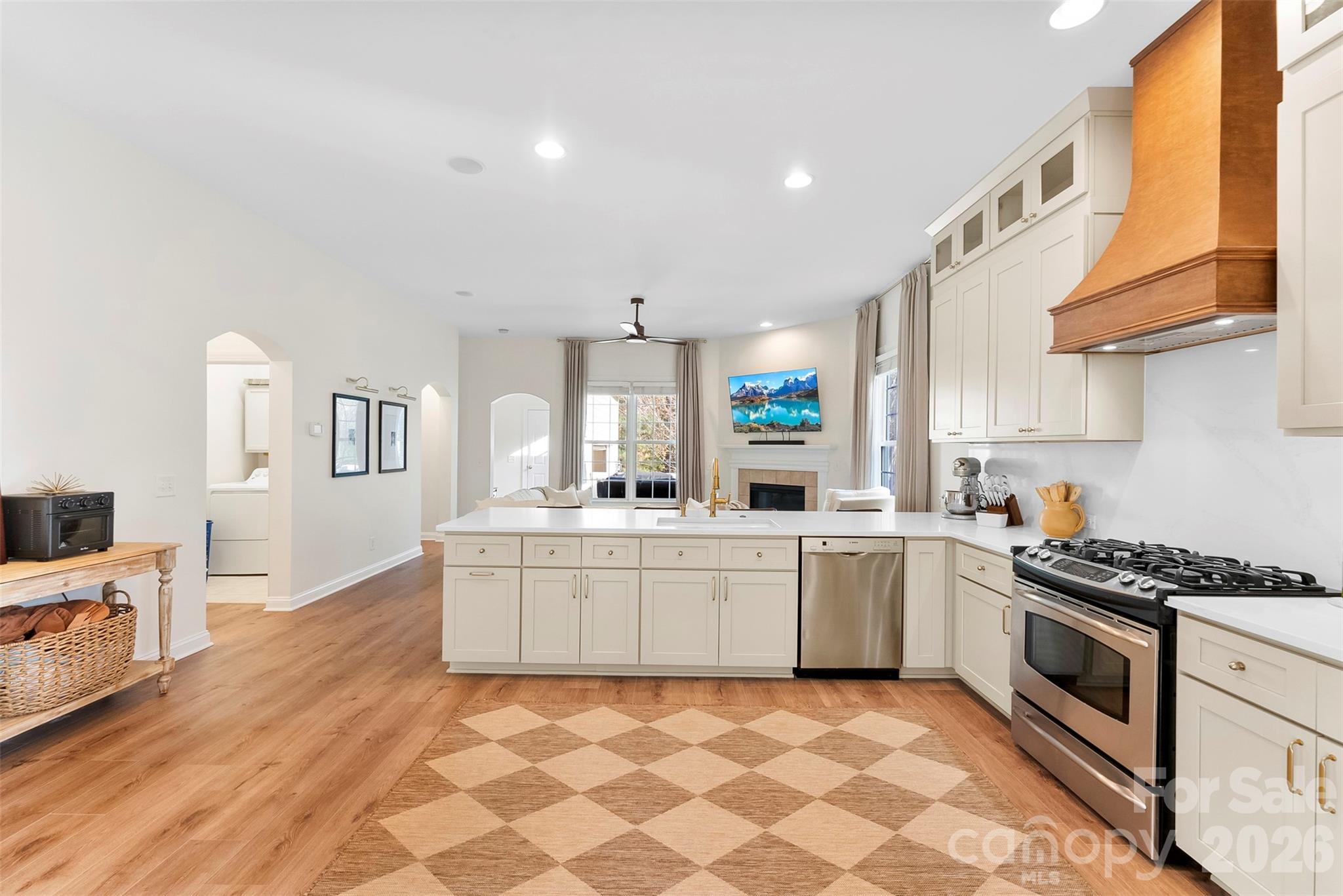 4115 Birkshire Heights Fort Mill, SC 29708 - Photo 11 of 36 a kitchen with stainless steel appliances a stove a sink and a refrigerator