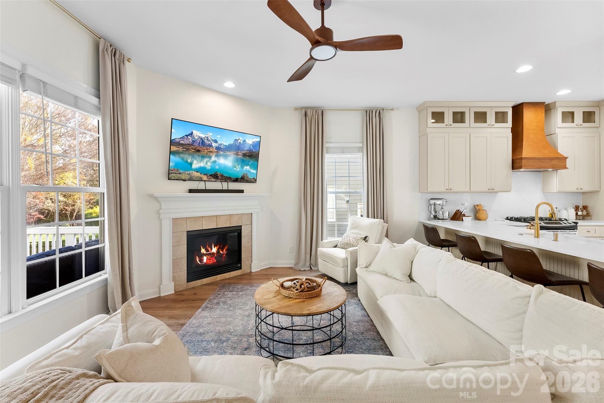 4115 Birkshire Heights Fort Mill, SC 29708 - Photo 16 of 36 a living room with furniture a fireplace and a large window