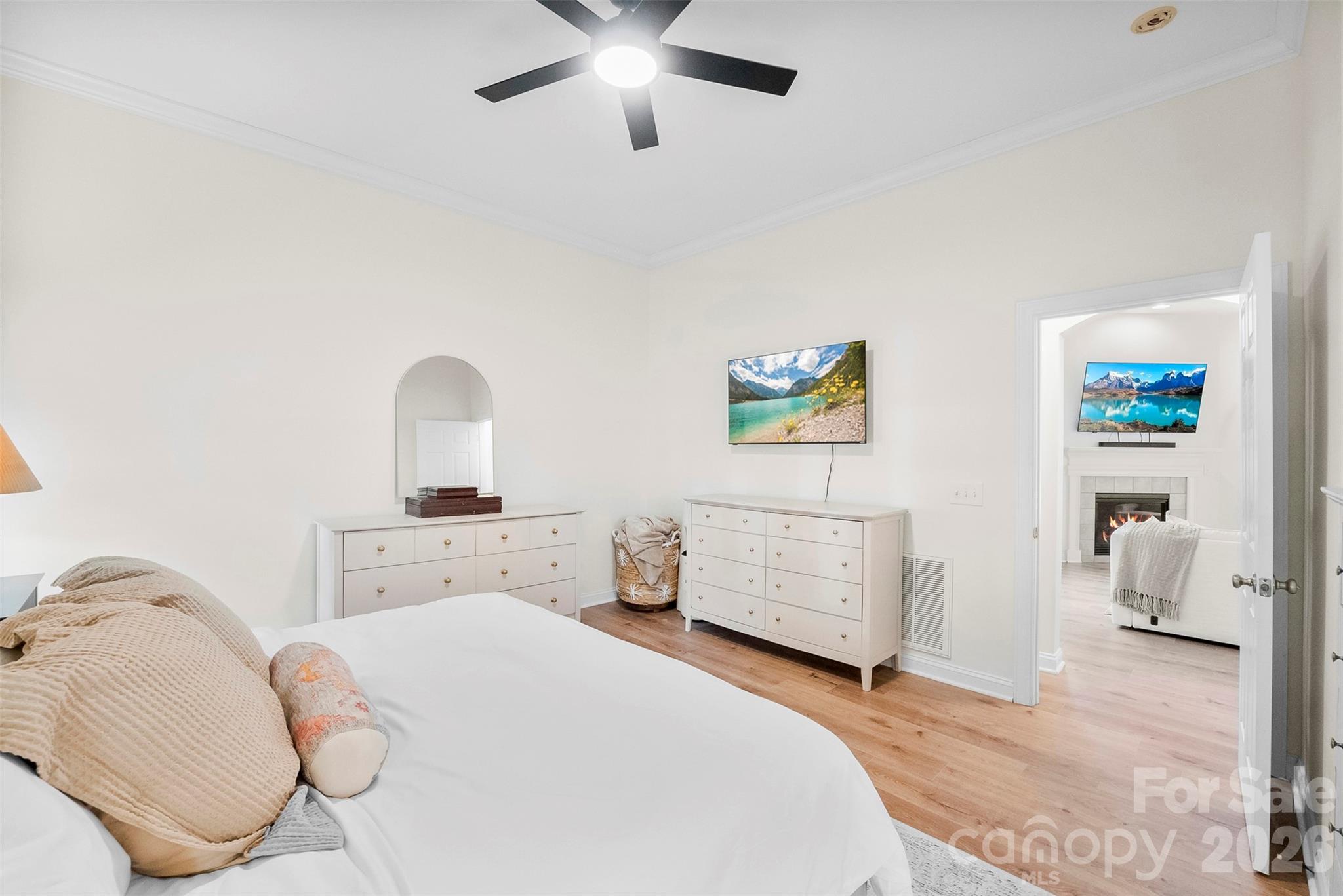 4115 Birkshire Heights Fort Mill, SC 29708 - Photo 24 of 36 a bedroom with a bed and ceiling fan