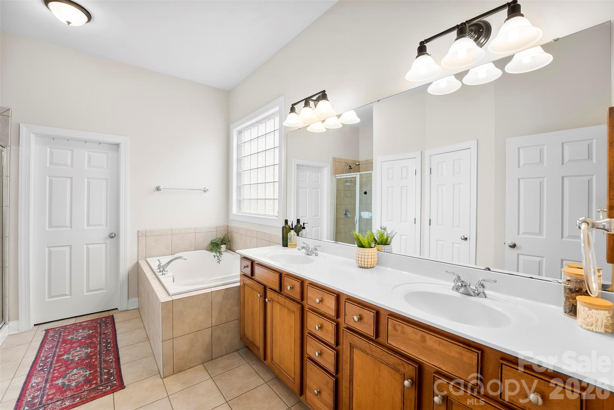 4115 Birkshire Heights Fort Mill, SC 29708 - Photo 25 of 36 a spacious bathroom with a double vanity sink mirror and bathtub