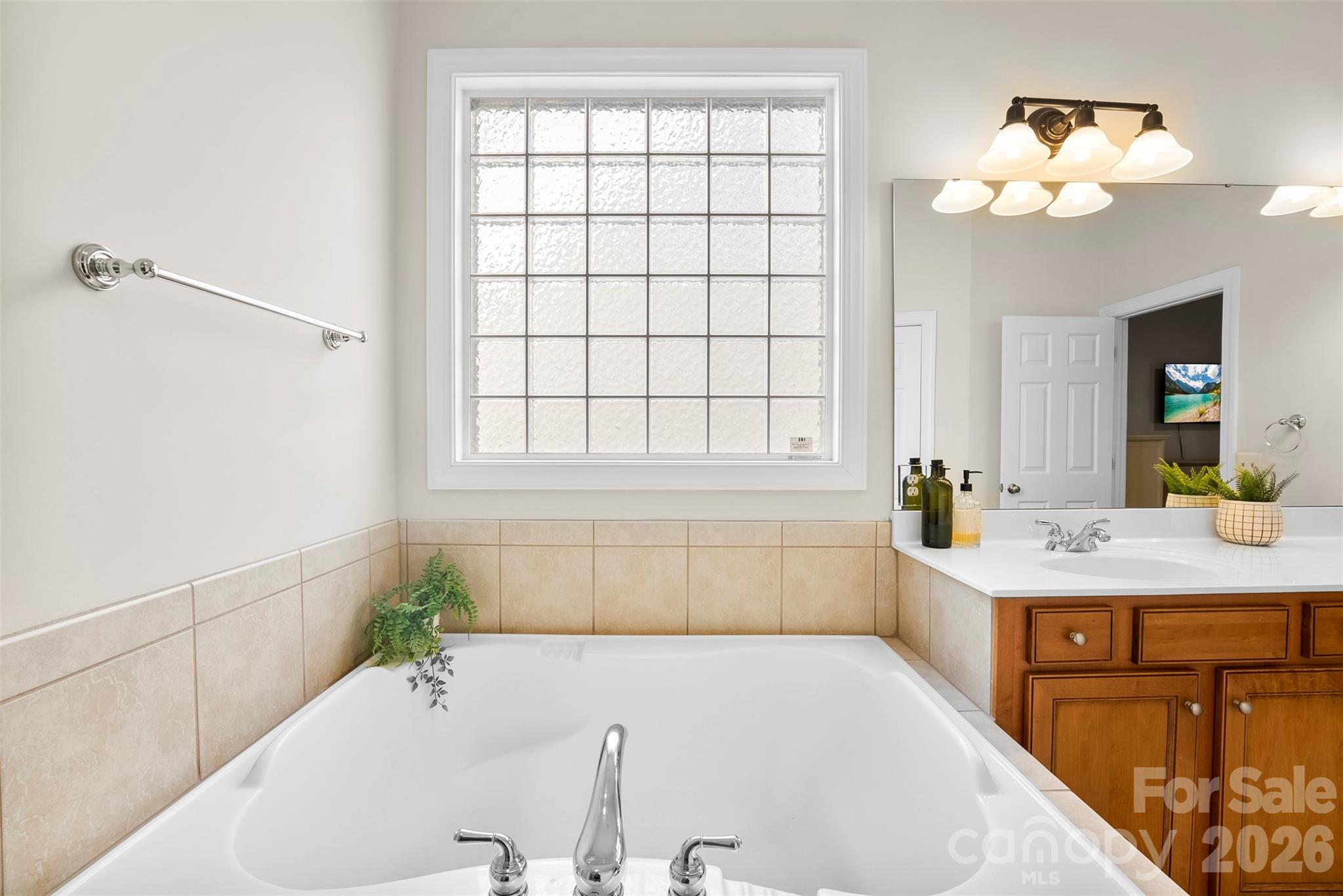 4115 Birkshire Heights Fort Mill, SC 29708 - Photo 26 of 36 a bathroom with a bathtub and a sink
