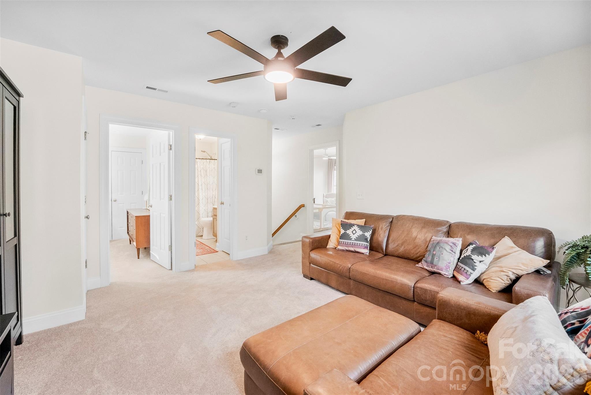 4115 Birkshire Heights Fort Mill, SC 29708 - Photo 29 of 36 a living room with furniture and a ceiling fan