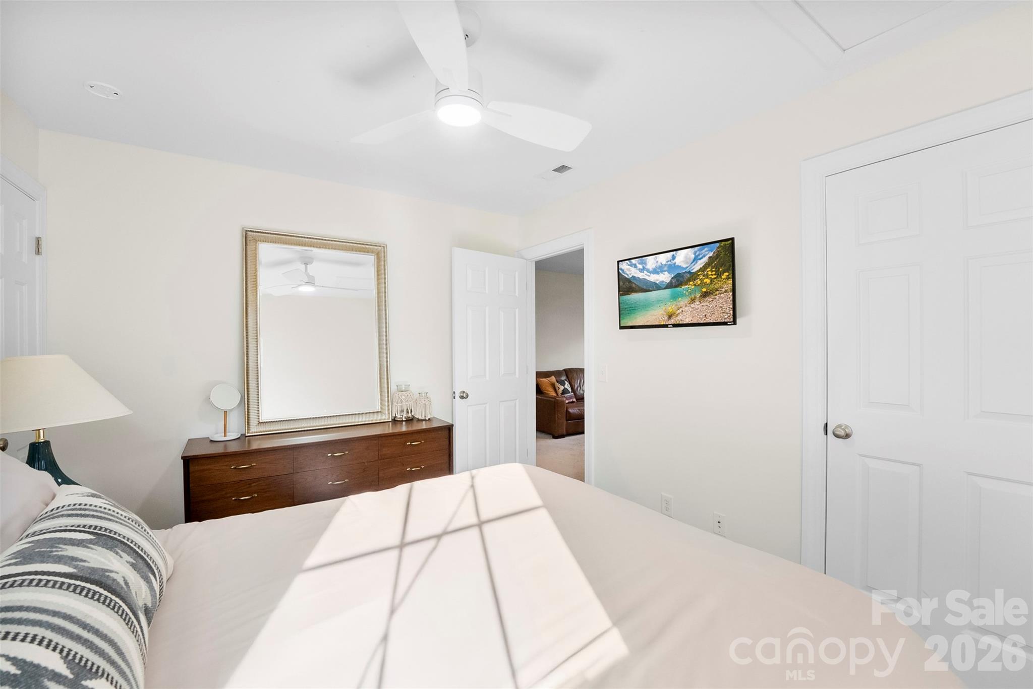 4115 Birkshire Heights Fort Mill, SC 29708 - Photo 31 of 36 a bedroom with a large bed and a couch