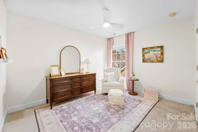 a view of living room with furniture and wooden floor