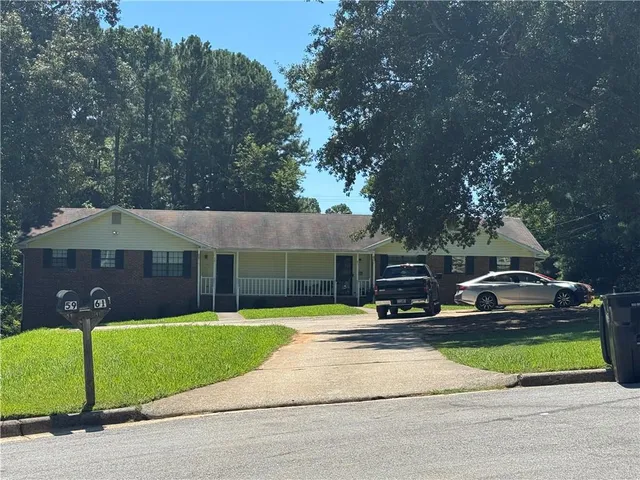 a view of house with yard and entertaining space