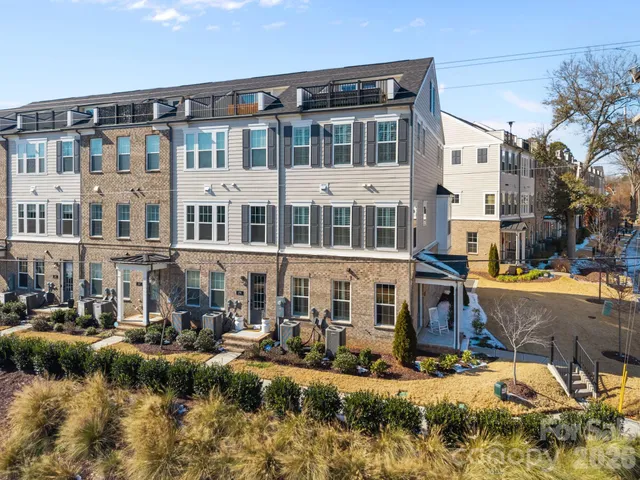 a front view of a building with lake view and boat