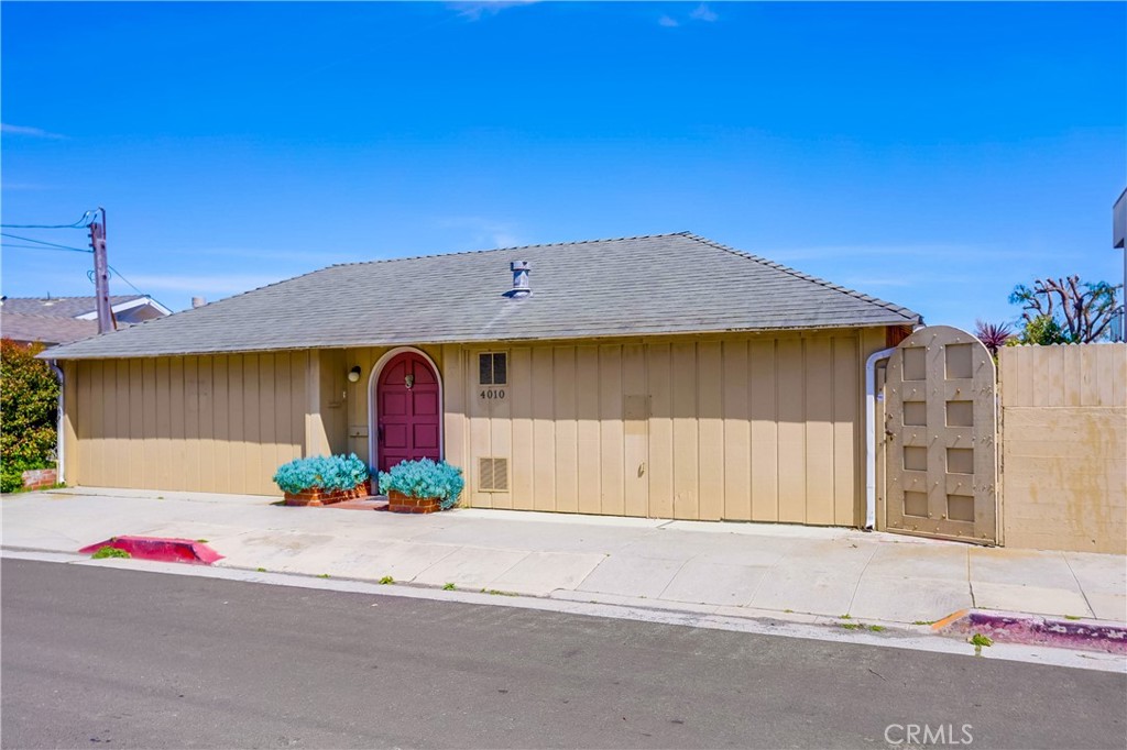 4010 Bluff Place San Pedro, CA 90731 - Photo 2 of 72 a front view of a house with a yard and garage
