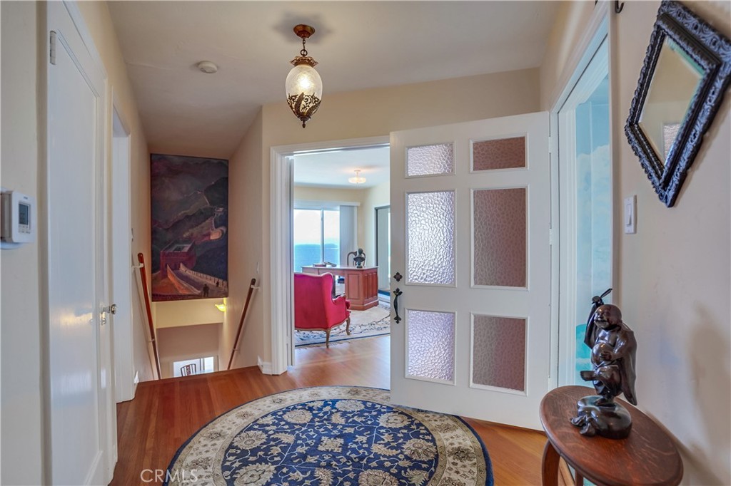 4010 Bluff Place San Pedro, CA 90731 - Photo 45 of 72 a bedroom with furniture and a chandelier