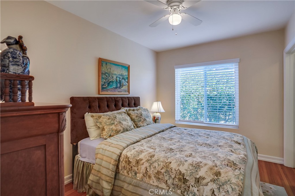 4010 Bluff Place San Pedro, CA 90731 - Photo 60 of 72 a bedroom with a large bed and a chandelier