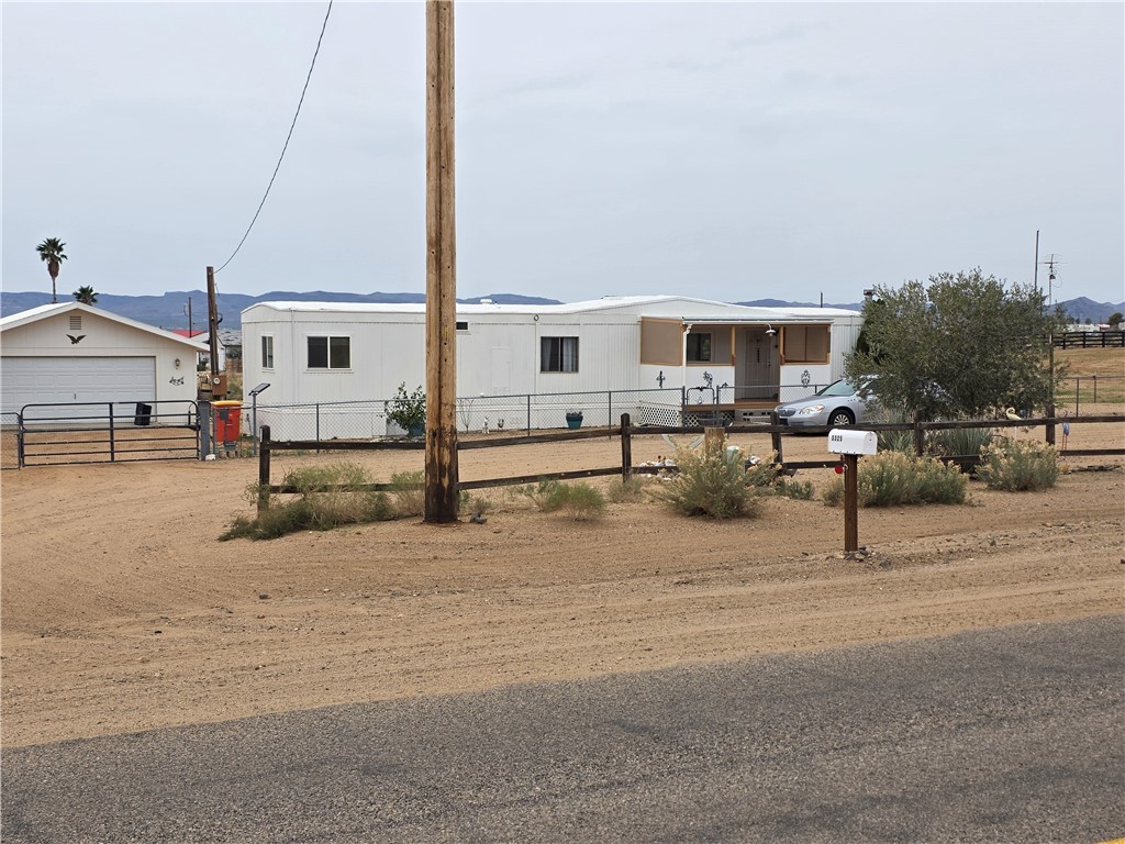 3325 Bacobi Road Golden Valley, AZ 86413 - Photo 1 of 44 Manufactured / mobile home featuring a fenced front yard