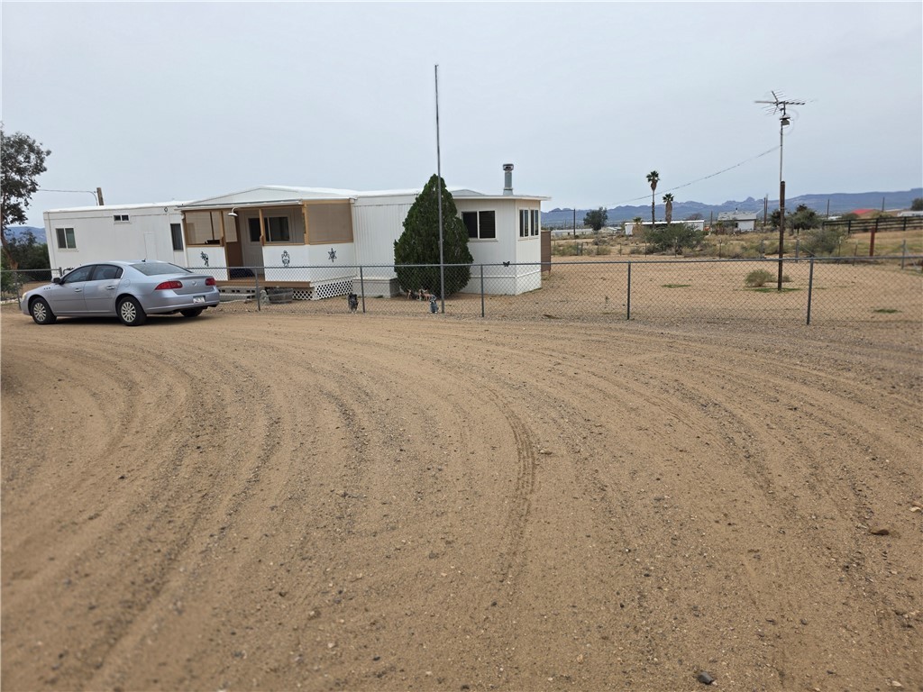 3325 Bacobi Road Golden Valley, AZ 86413 - Photo 8 of 44 View of manufactured mobile home & circular driveway.