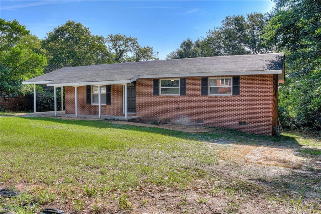 2424 Ridge Road Augusta, GA 30906 - Photo 1 of 1 a backyard of a house with yard and outdoor seating