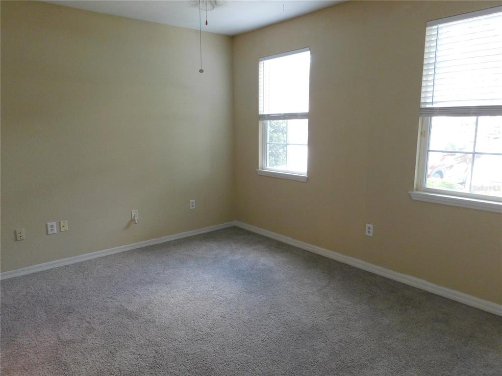 3480 Soho Street, Unit 101 Orlando, FL 32835 - Photo 12 of 29 an empty room with a window