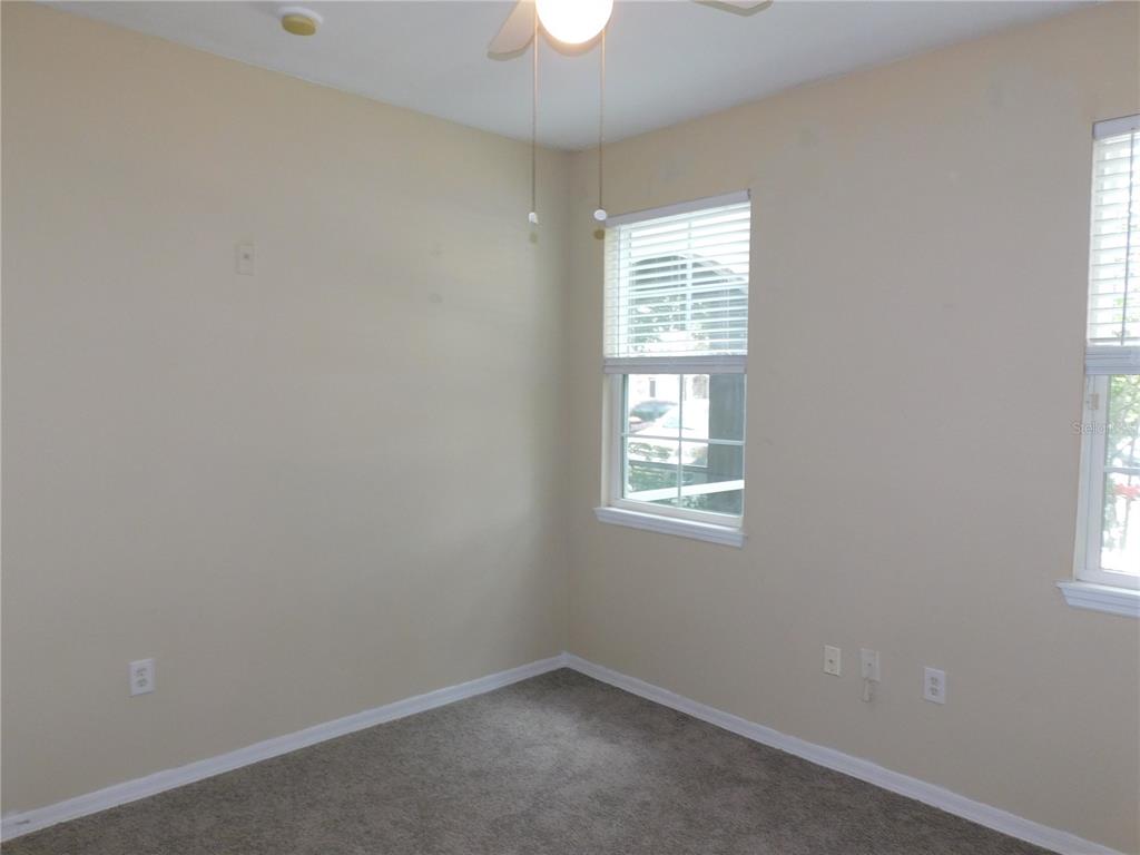 3480 Soho Street, Unit 101 Orlando, FL 32835 - Photo 19 of 29 an empty room with a window