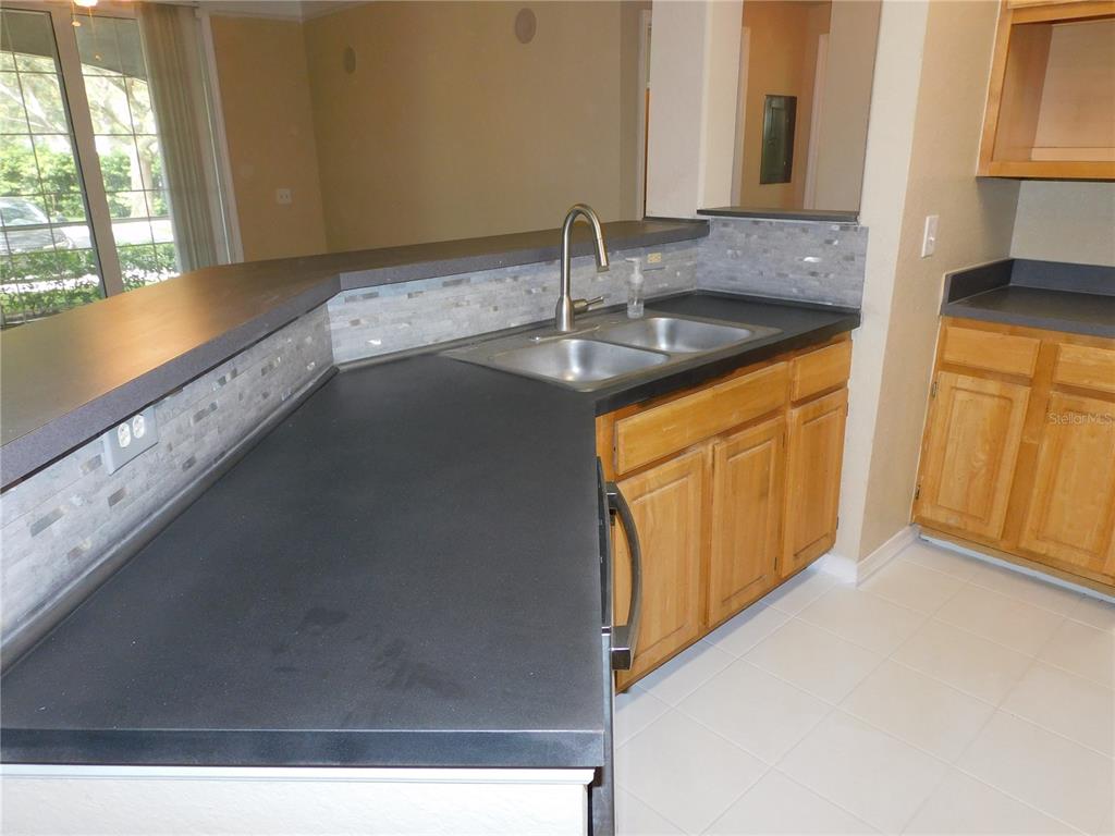 3480 Soho Street, Unit 101 Orlando, FL 32835 - Photo 6 of 29 a bathroom with a sink and a mirror