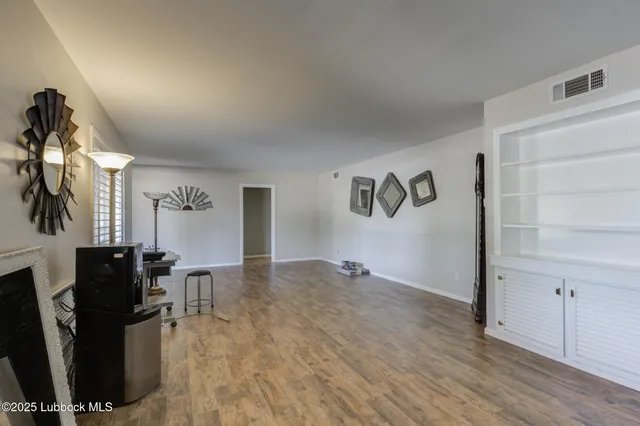 a view of room with window and ceiling fan