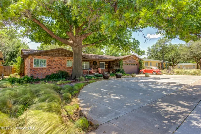 a view of yard with patio