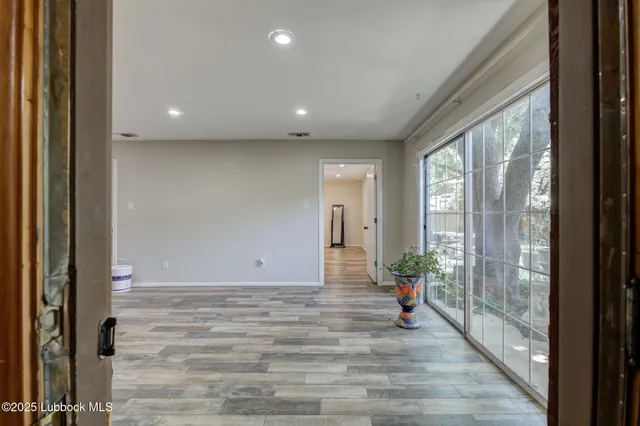 a bathroom with a granite countertop sink toilet a mirror and a shower