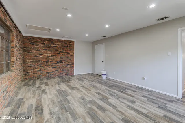 a bathroom with a granite countertop bathtub shower sink mirror