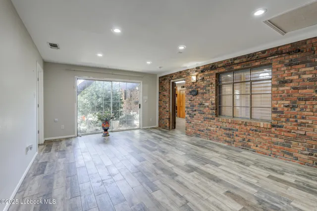 a backyard of a house with yard and outdoor seating