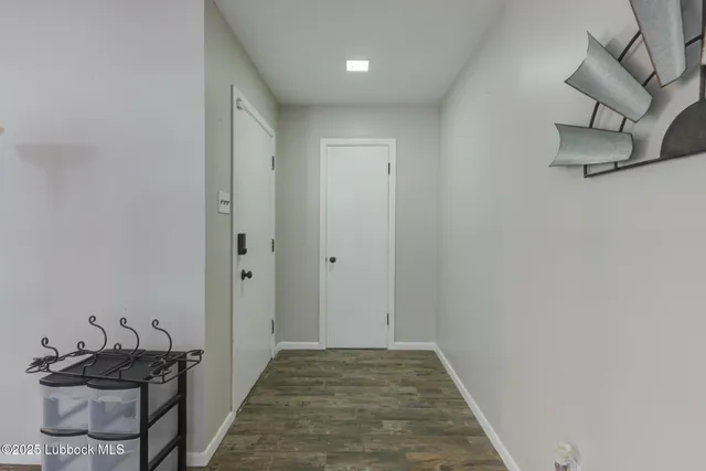 a view of a livingroom with a lounge chair and a large window