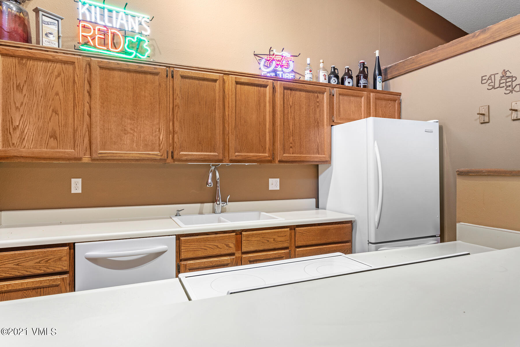 225 Gopher Road, Unit 46 Avon, CO 81620 - Photo 12 of 34 a bathroom with a refrigerator and cabinets