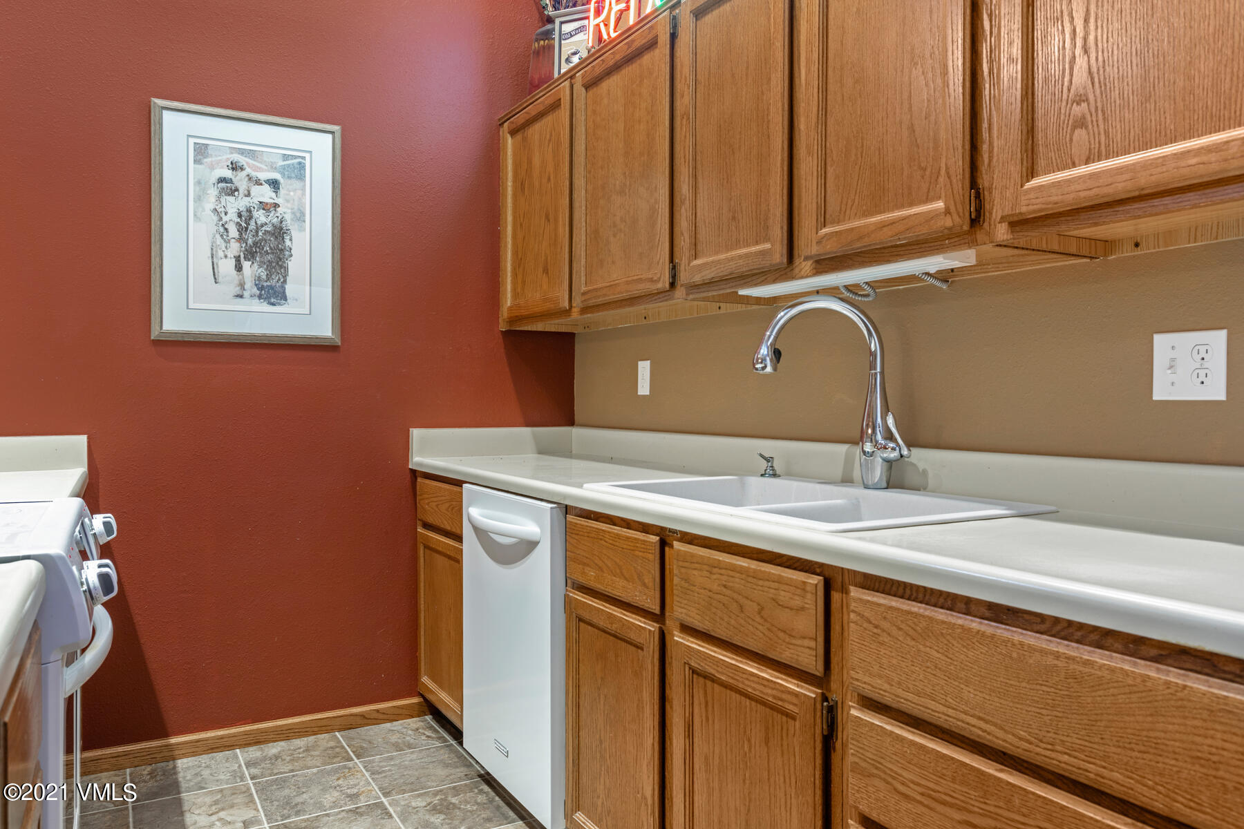 225 Gopher Road, Unit 46 Avon, CO 81620 - Photo 13 of 34 a kitchen with a sink cabinets and utility