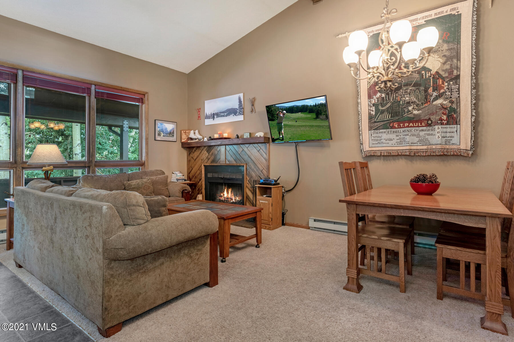 225 Gopher Road, Unit 46 Avon, CO 81620 - Photo 3 of 34 a living room with furniture and a flat screen tv