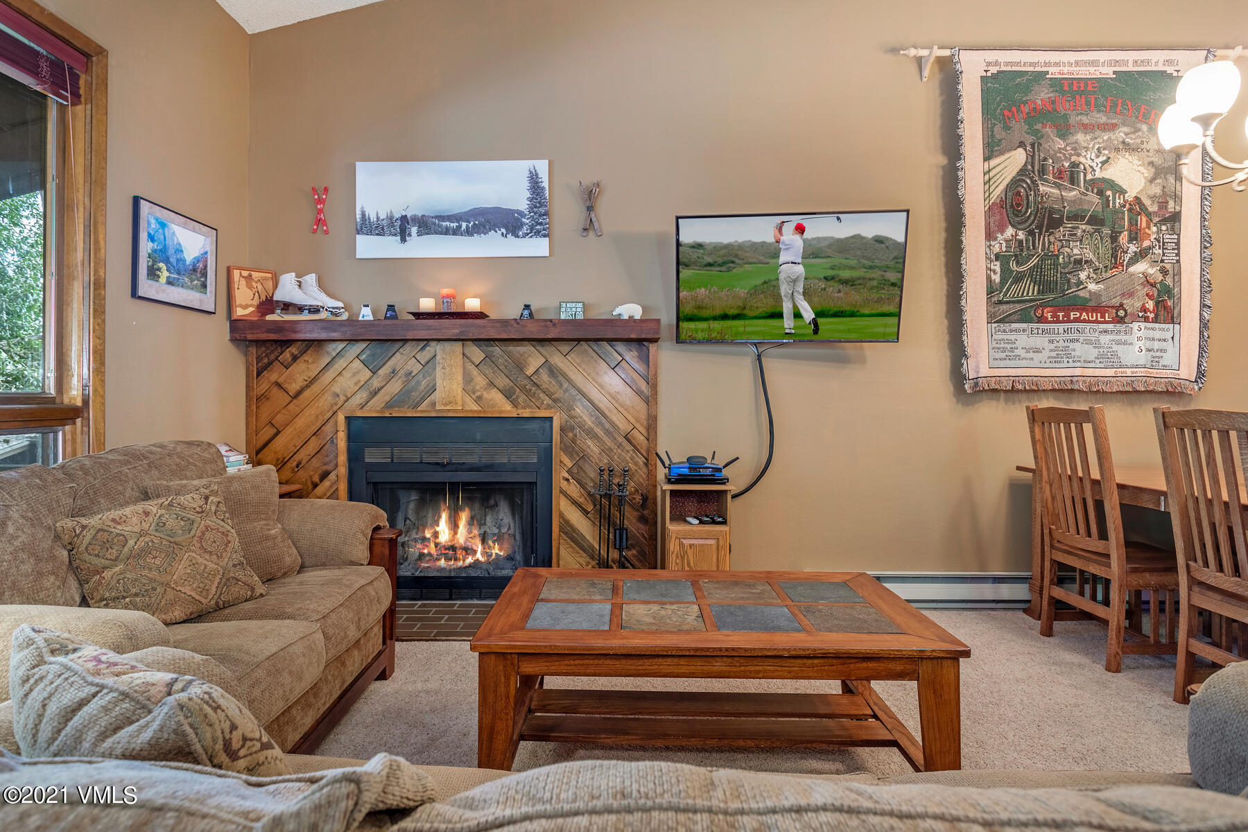 225 Gopher Road, Unit 46 Avon, CO 81620 - Photo 4 of 34 a living room with furniture and a fireplace