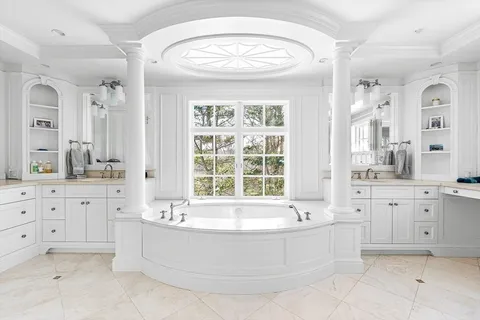 a bathroom with sink bathtub and shower