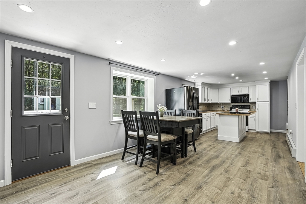 334 Mendon Road Northbridge, MA 01534 - Photo 11 of 31 a kitchen with a table and chairs in it