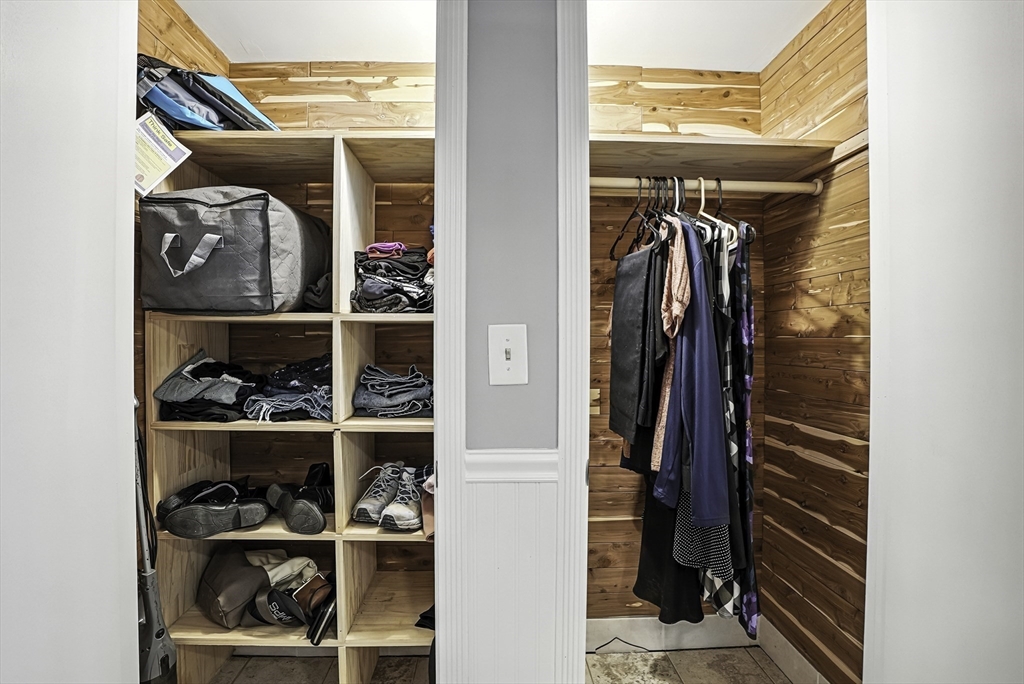 334 Mendon Road Northbridge, MA 01534 - Photo 25 of 31 a view of walk in closet with clothes and shoes