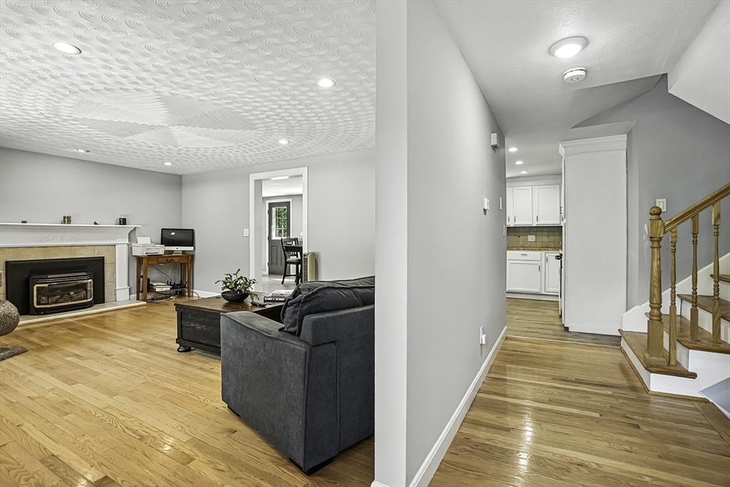 334 Mendon Road Northbridge, MA 01534 - Photo 3 of 31 a living room with furniture and a fireplace