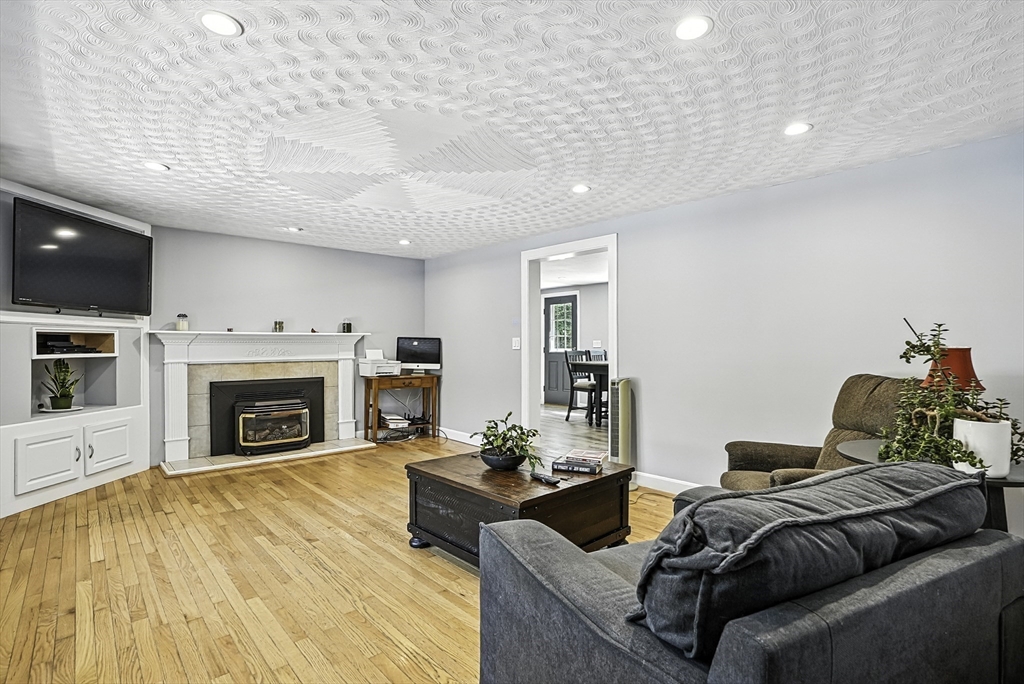 334 Mendon Road Northbridge, MA 01534 - Photo 4 of 31 a living room with furniture and a fireplace