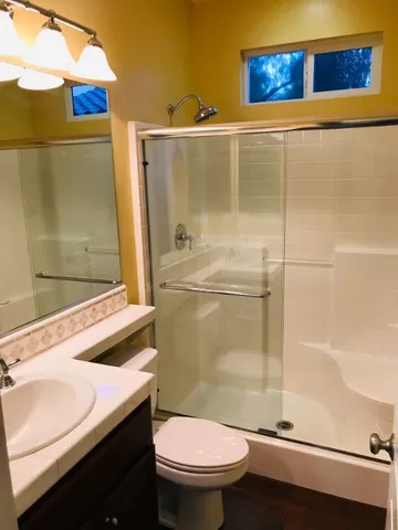 an empty room with windows and entrance