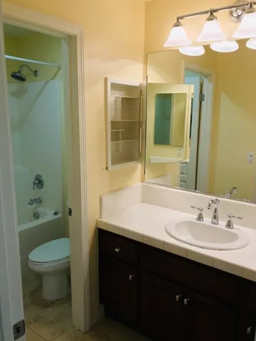 a view of a bathroom from a hallway
