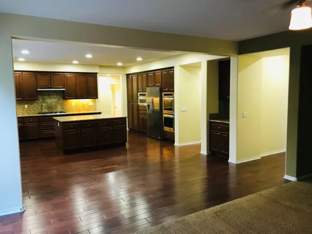a bathroom with a sink and mirror with toilet