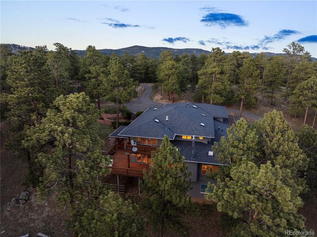 an aerial view of house with a garden