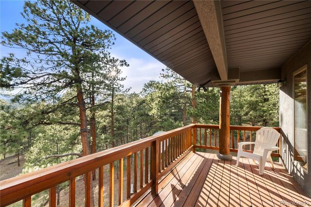 a view of balcony with wooden floor