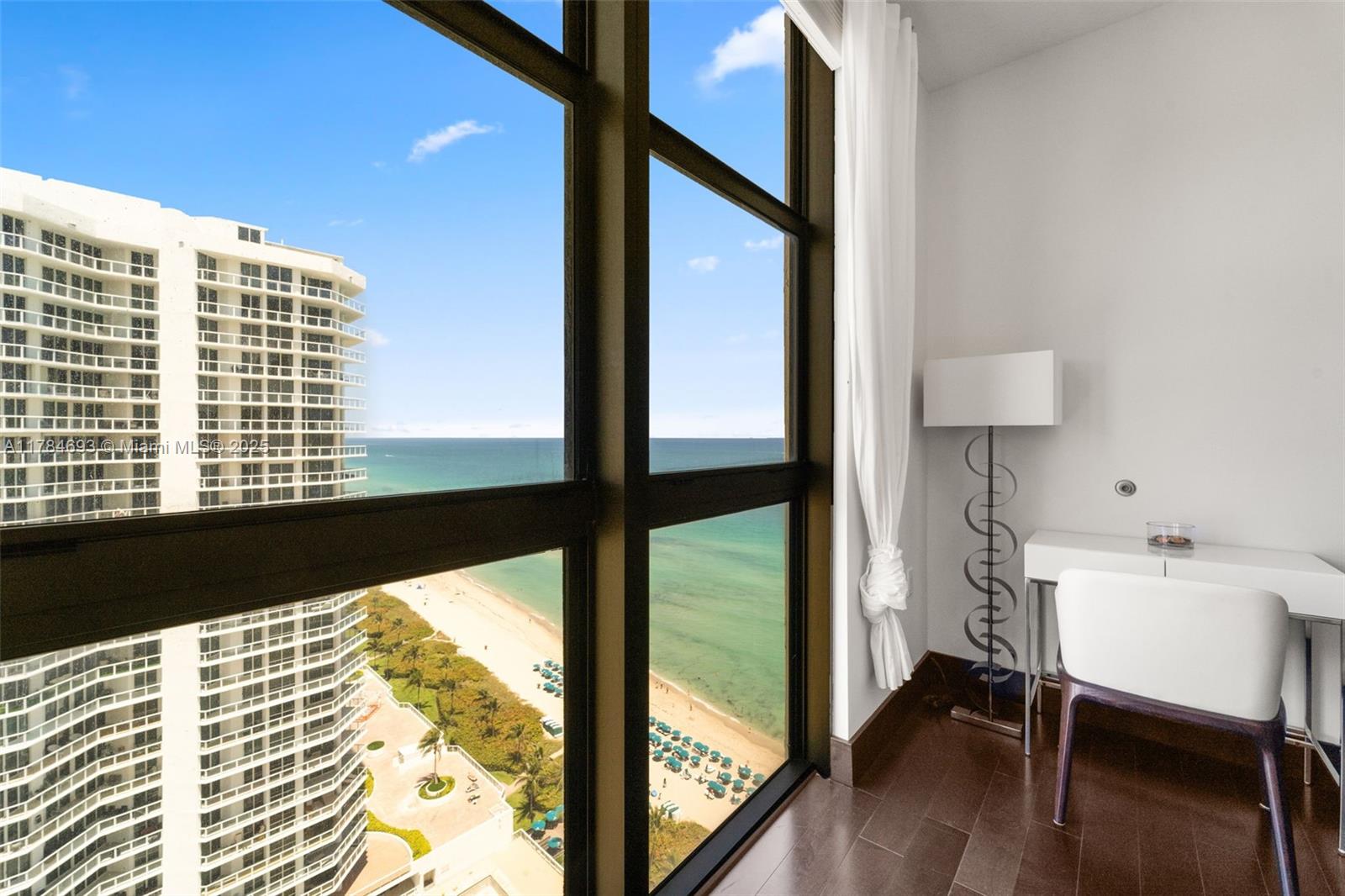 16275 Collins Avenue, Unit 2202 Sunny Isles Beach, FL 33160 - Photo 13 of 23 a view of a large window with wooden floor
