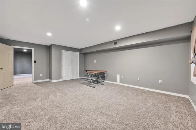 a view of backyard with deck and wooden floor