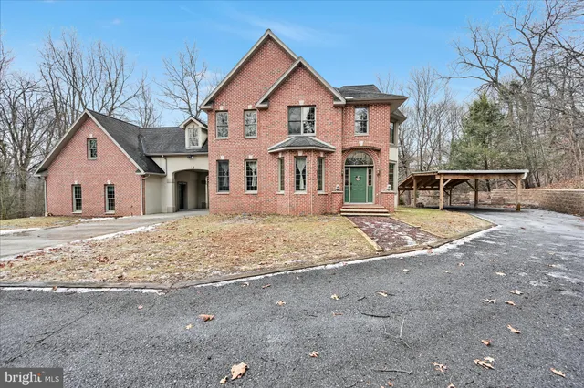 a view of a house with a yard and garage