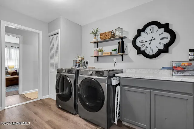 a view of a storage and utility room with a washer dryer