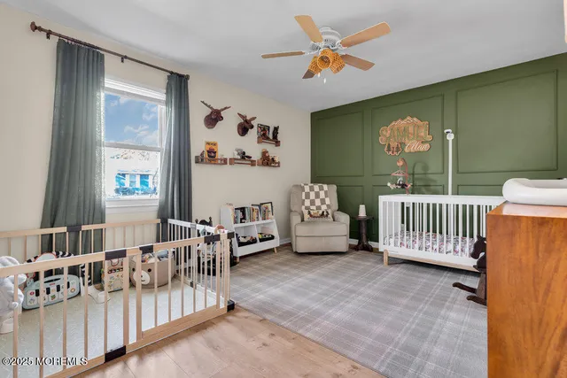 a bedroom with furniture and a window