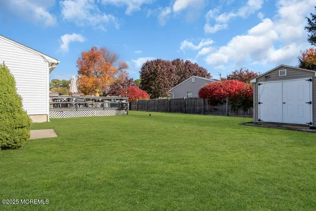 a view of an house with backyard space and garden