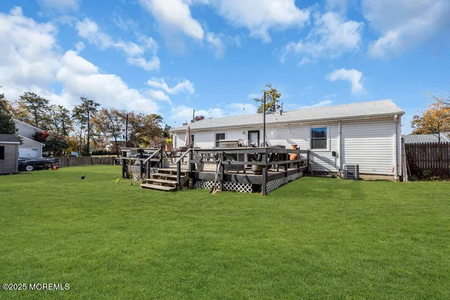 a view of a house with a back yard