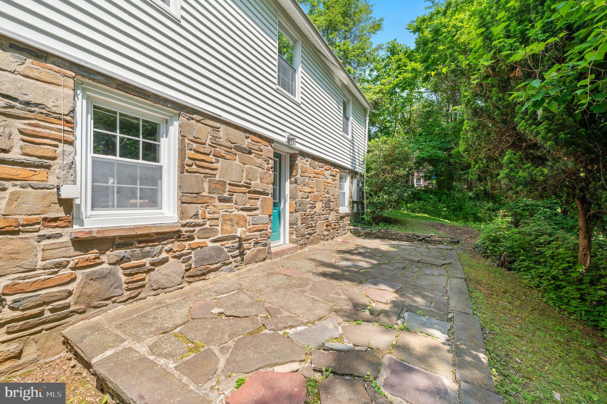 653 Broad Acres Road Penn Valley, PA 19072 - Photo 10 of 35 a view of a house with a backyard