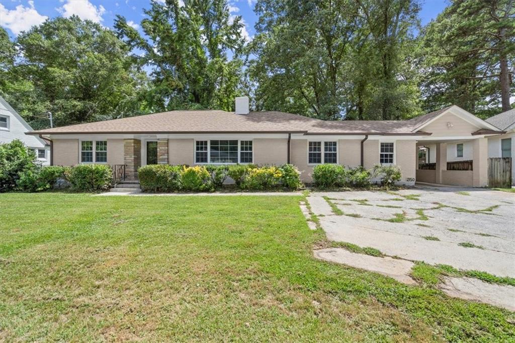 2150 Cascade Road Atlanta, GA 30311 - Photo 1 of 1 a front view of a house with a garden