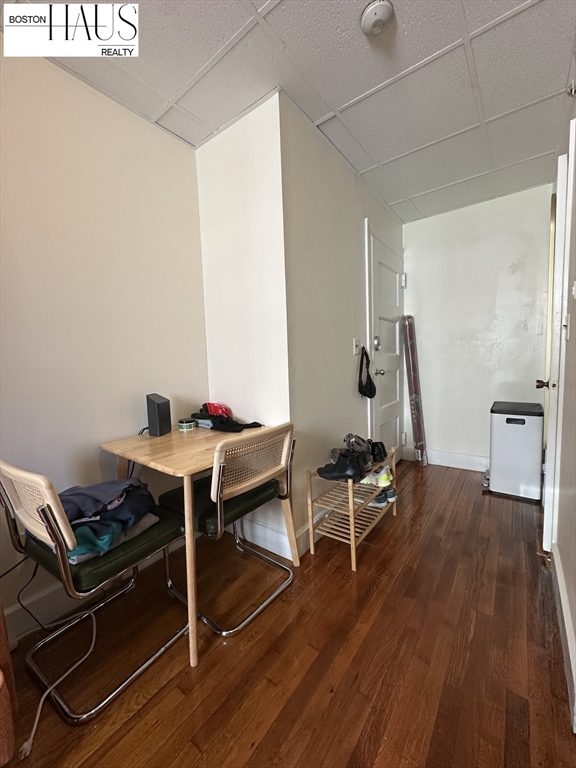 505 Beacon Street, Unit 12 Boston, MA 02215 - Photo 2 of 5 a view of a workspace with furniture and wooden floor